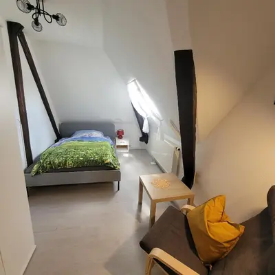 Ein Bett oder Betten in einem Zimmer der Unterkunft Ferienwohnung am Lockwitzbach