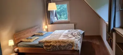 Ein Bett oder Betten in einem Zimmer der Unterkunft Ferienhaus Waldhäus'l