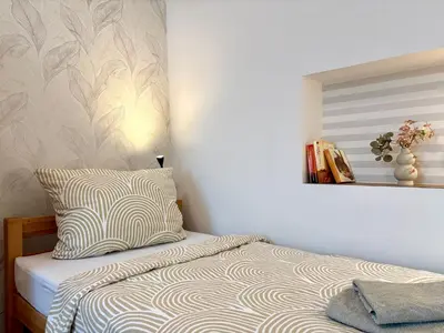 Ein Bett oder Betten in einem Zimmer der Unterkunft FEWO 1 Landeskrone Dresden