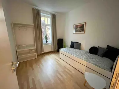 Ein Bett oder Betten in einem Zimmer der Unterkunft Ein gemütlicher Platz im Gründerzeitviertel