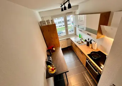 Küche/Küchenzeile in der Unterkunft KMHosting Zentrum Modern Appartement - Kingsize Boxspringbett