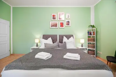 Ein Bett oder Betten in einem Zimmer der Unterkunft GREENs - ruhige schöne 1RWhg gut gelegen mit Balkon