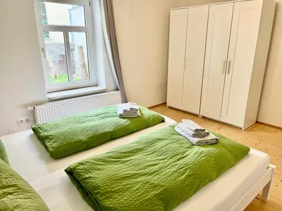 Ein Bett oder Betten in einem Zimmer der Unterkunft Meißner Elb-Domizil