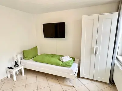 Ein Bett oder Betten in einem Zimmer der Unterkunft Meißner Elb-Domizil