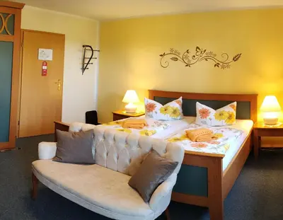 Ein Bett oder Betten in einem Zimmer der Unterkunft Pension Villa Irene