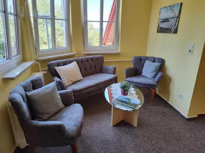 Ein Sitzbereich in der Unterkunft Pension Villa Irene