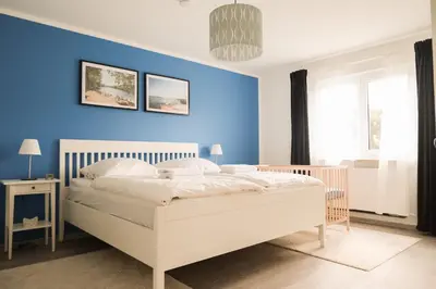 Ein Bett oder Betten in einem Zimmer der Unterkunft Haus Hummel