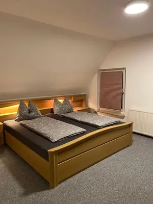 Ein Bett oder Betten in einem Zimmer der Unterkunft Am Fuße zur Napoleonschanze