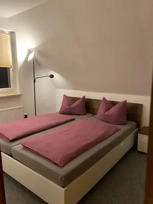 Ein Bett oder Betten in einem Zimmer der Unterkunft Am Fuße zur Napoleonschanze