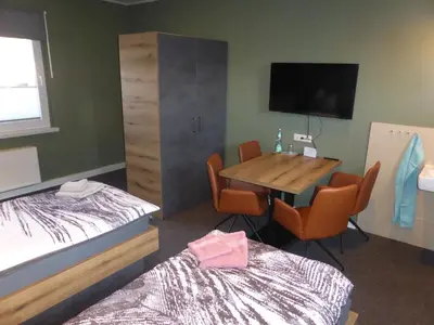Ein Bett oder Betten in einem Zimmer der Unterkunft Gästezimmer in einer Ferienwohnung Thiele in Roßwein