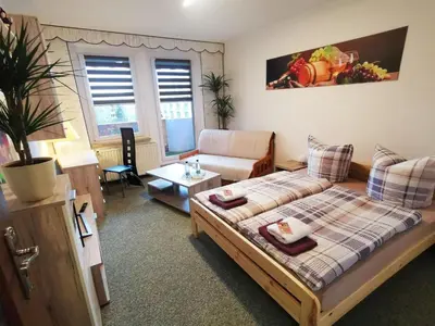 Ein Bett oder Betten in einem Zimmer der Unterkunft Fewo Oeffingener Meißen