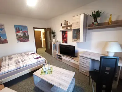 Ein Bett oder Betten in einem Zimmer der Unterkunft Fewo Oeffingener Meißen