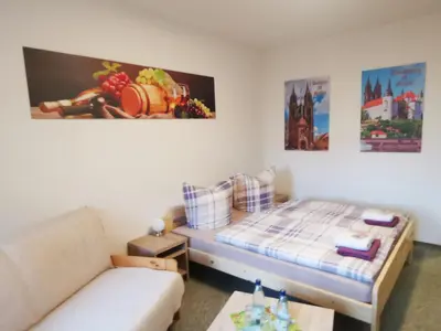Ein Bett oder Betten in einem Zimmer der Unterkunft Fewo Oeffingener Meißen