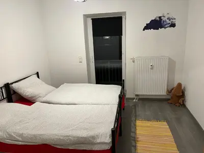 Ein Bett oder Betten in einem Zimmer der Unterkunft MyHome Einsiedel an der Zwönitz 2