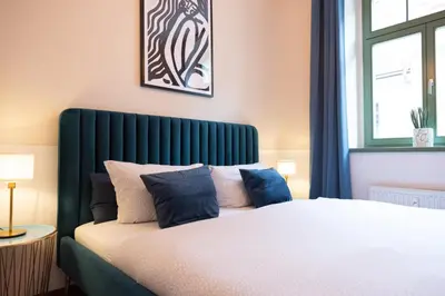 Ein Bett oder Betten in einem Zimmer der Unterkunft Boutique Suiten Altstadt am Malerweg
