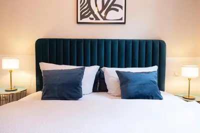 Ein Bett oder Betten in einem Zimmer der Unterkunft Boutique Suiten Altstadt am Malerweg