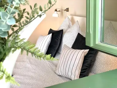 Ein Bett oder Betten in einem Zimmer der Unterkunft Boutique Suiten Altstadt am Malerweg