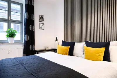 Ein Bett oder Betten in einem Zimmer der Unterkunft Urban Suite Pirna Altstadt am Markt