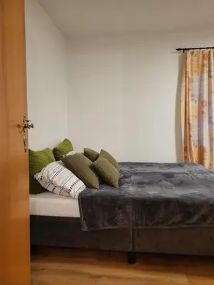 Ein Bett oder Betten in einem Zimmer der Unterkunft Haus Svetlana Ferienwohnung