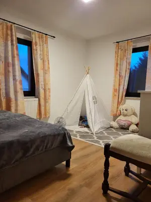 Ein Bett oder Betten in einem Zimmer der Unterkunft Haus Svetlana Ferienwohnung