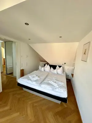Ein Bett oder Betten in einem Zimmer der Unterkunft Luxus Suite mit einmaligem Blick auf die Frauenkirche
