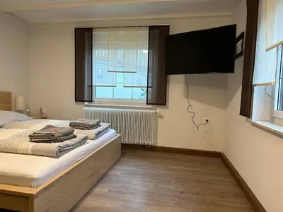 Ein Bett oder Betten in einem Zimmer der Unterkunft Ferienwohnung zum Winterberg