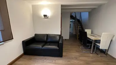 Ein Sitzbereich in der Unterkunft Ferienwohnung zum Winterberg