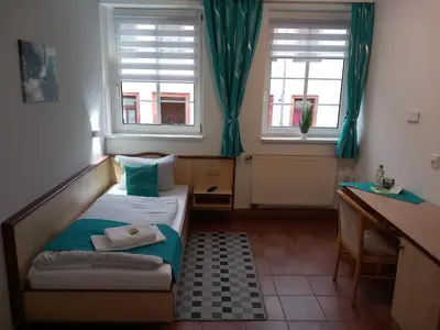 Ein Bett oder Betten in einem Zimmer der Unterkunft Hotel Eintracht
