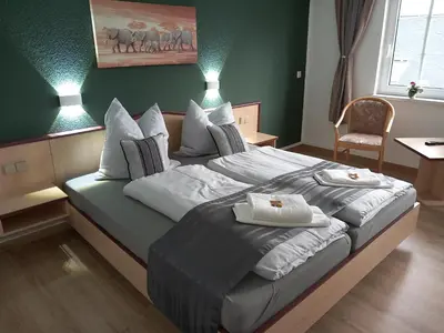Ein Bett oder Betten in einem Zimmer der Unterkunft Hotel Eintracht