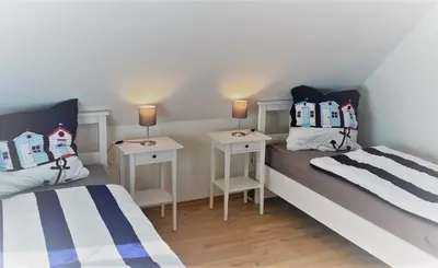 Ein Bett oder Betten in einem Zimmer der Unterkunft Haus-Am-See-Pratzschwitz