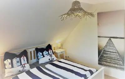Ein Bett oder Betten in einem Zimmer der Unterkunft Haus-Am-See-Pratzschwitz