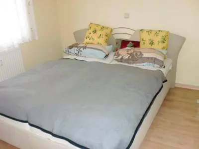 Ein Bett oder Betten in einem Zimmer der Unterkunft FeWo ab 3 Übernachtungen