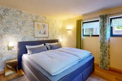 Ein Bett oder Betten in einem Zimmer der Unterkunft Ferienwohnung Sächsische Schweiz Kurort Rathen