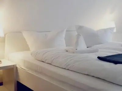 Ein Bett oder Betten in einem Zimmer der Unterkunft Lindenhof Apartments Bad Schandau