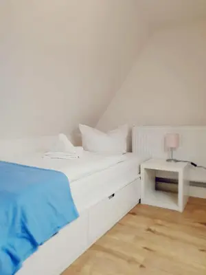 Ein Bett oder Betten in einem Zimmer der Unterkunft Lindenhof Apartments Bad Schandau