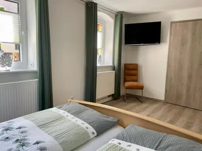 Ein Bett oder Betten in einem Zimmer der Unterkunft Ferienwohnung 