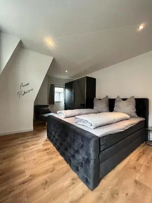 Ein Bett oder Betten in einem Zimmer der Unterkunft Ferienwohnung Zimmermann