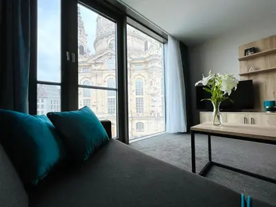 Ein Bett oder Betten in einem Zimmer der Unterkunft Einzigartiges Panoramaapartment an der Frauenkirche