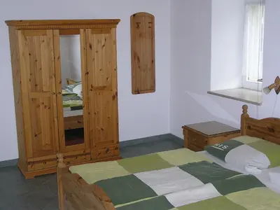 Ein Bett oder Betten in einem Zimmer der Unterkunft Ferienwohnung Vordermühle