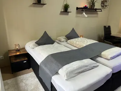 Ein Bett oder Betten in einem Zimmer der Unterkunft Adam's Pension