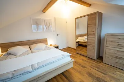 Ein Bett oder Betten in einem Zimmer der Unterkunft Hochwertiges Apartment / 120m² / Dachterrasse / Parking