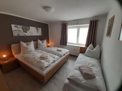 Ein Bett oder Betten in einem Zimmer der Unterkunft NEU! Ferienwohnung Hanka