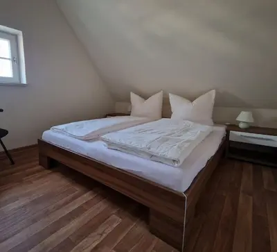 Ein Bett oder Betten in einem Zimmer der Unterkunft Erbgericht Putzkau