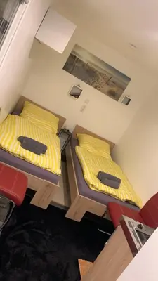Ein Bett oder Betten in einem Zimmer der Unterkunft Tiny-Ferienwohnungen Hellerau