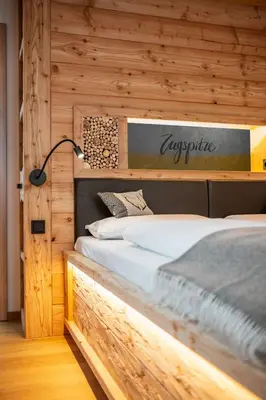 Ein Bett oder Betten in einem Zimmer der Unterkunft Zugspitze Apartment GLÜCK.AUF