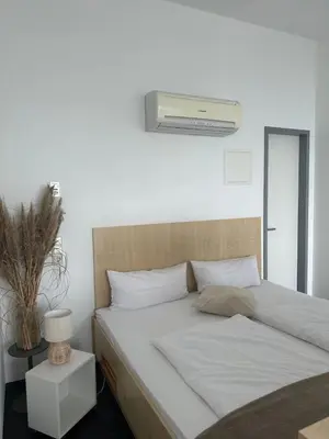 Ein Bett oder Betten in einem Zimmer der Unterkunft Doppelzimmer im Strandhaus 2