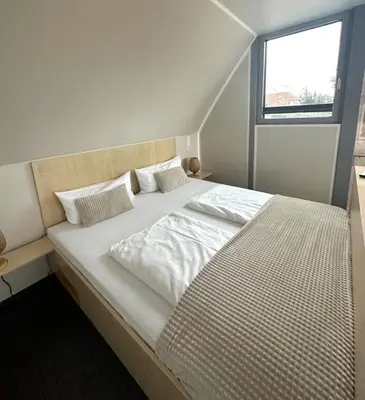 Ein Bett oder Betten in einem Zimmer der Unterkunft Appartment Düne 10 2OG