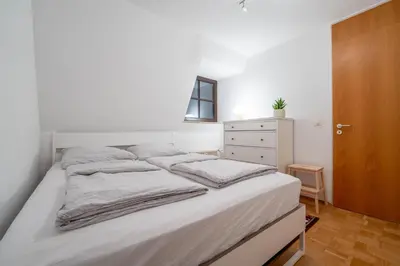 Ein Bett oder Betten in einem Zimmer der Unterkunft Loft mit Balkon im Historischen Altbau am Marktplatz - 75qm, DisneyPlus, 300mbs Internet