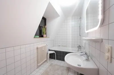 Ein Badezimmer in der Unterkunft Loft mit Balkon im Historischen Altbau am Marktplatz - 75qm, DisneyPlus, 300mbs Internet