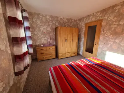 Ein Bett oder Betten in einem Zimmer der Unterkunft Ferienwohnung Weber